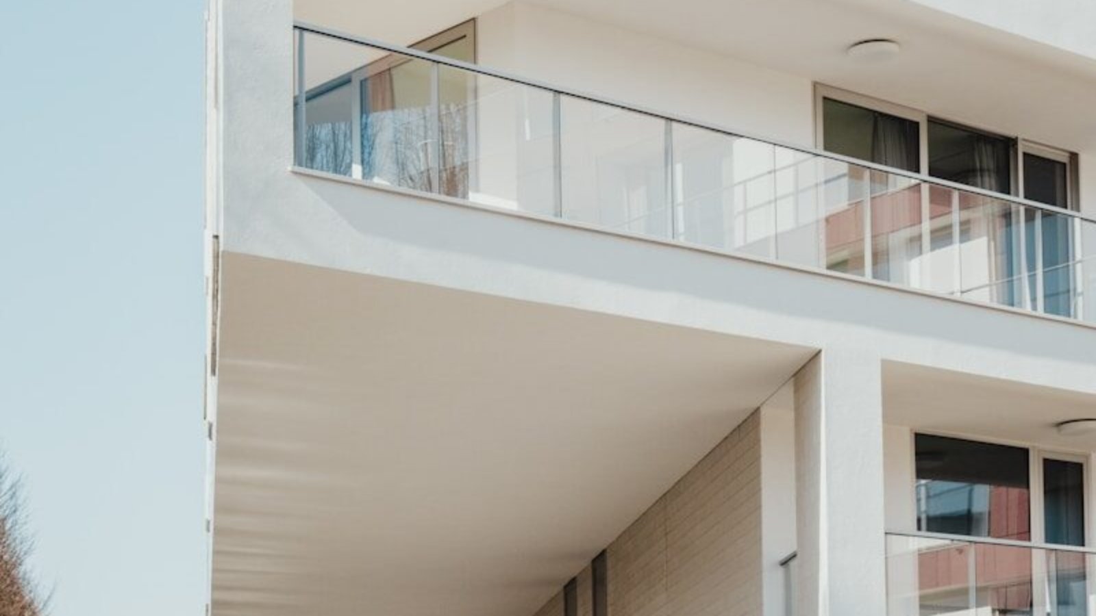 white concrete residential building near trees