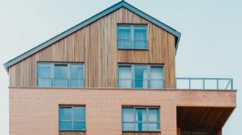 low-angle photo of brown house