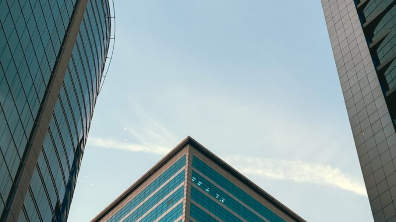 A couple of tall buildings sitting next to each other