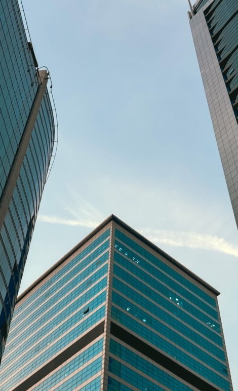 A couple of tall buildings sitting next to each other