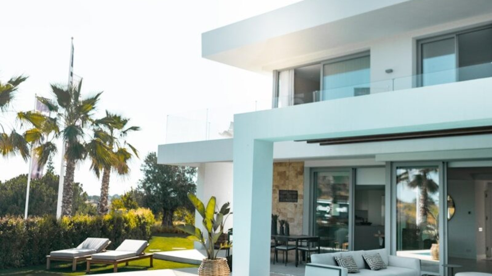 white concrete building with swimming pool