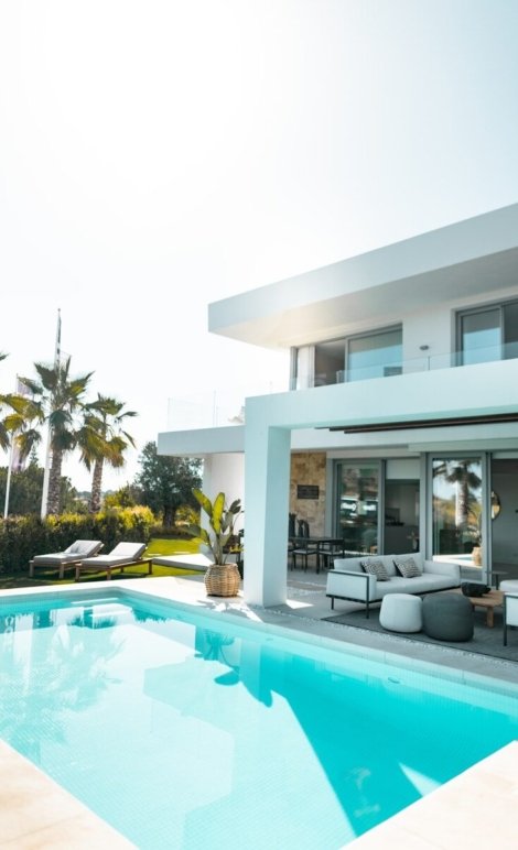 white concrete building with swimming pool